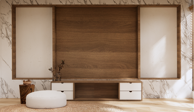 Meuble en bois avec tiroirs blancs, décoré de vases en verre, sur fond de mur en marbre et parquet clair.